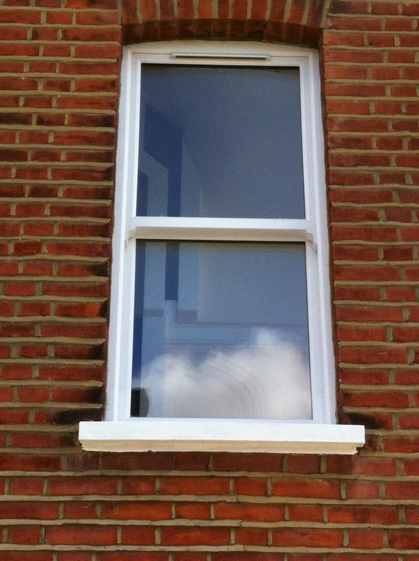 uPVC sash window on Victorian red brick house in Mill Hill
